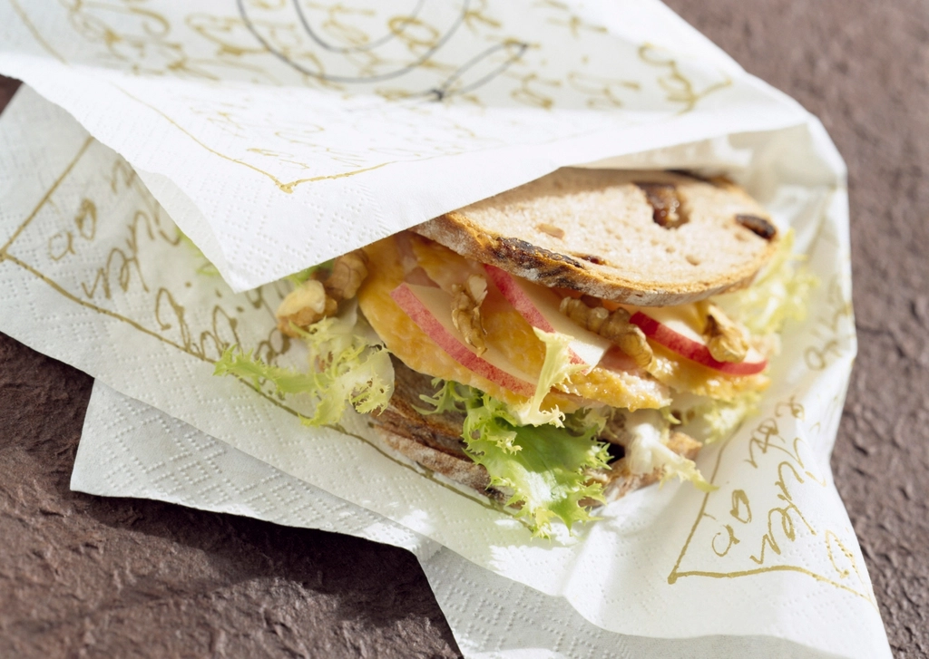 A fresh deli sub stacked with meat, cheese and vegetables